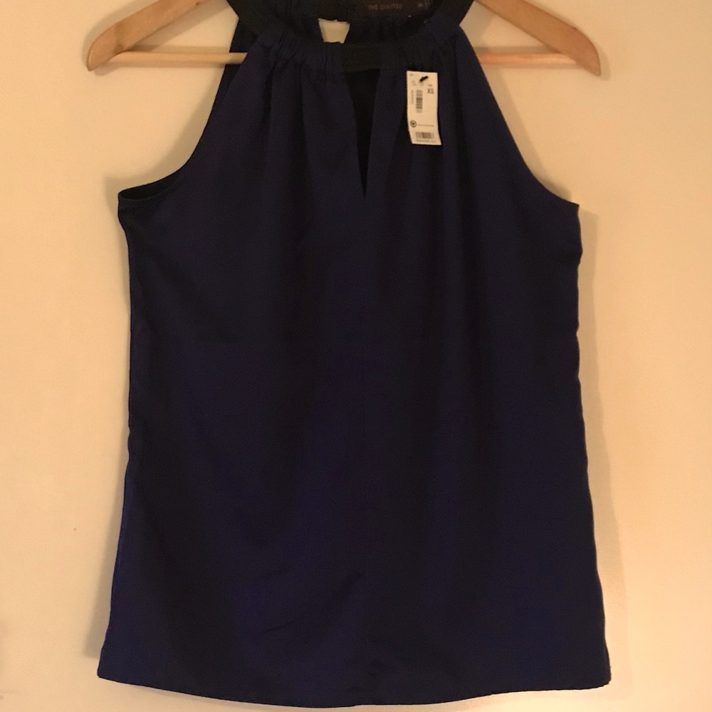 The limited. Halter top. Never worn/with tags. XS